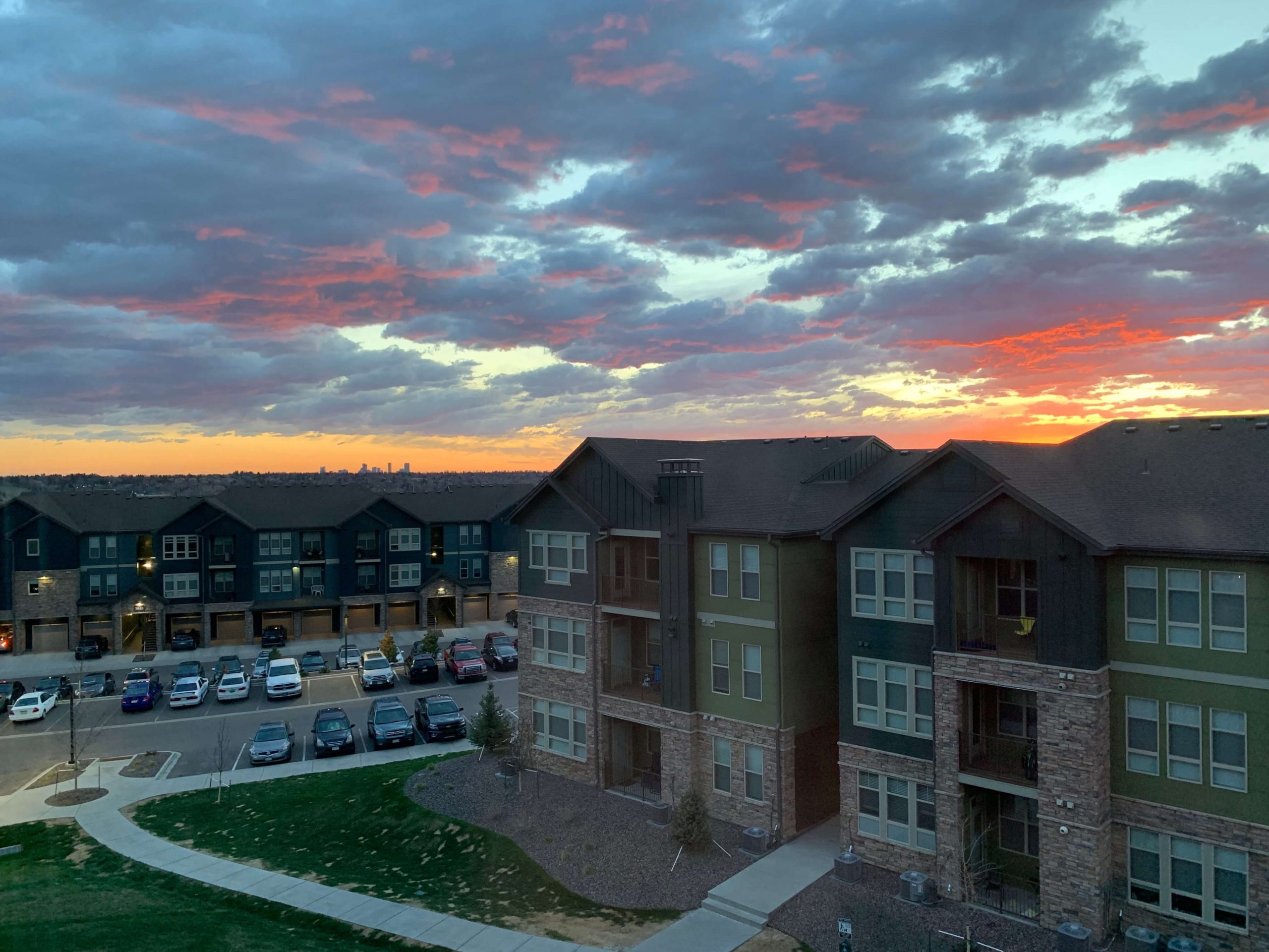Colorful sunrise over a distant downtown Denver